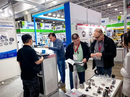 Visitors communicating with the CUKU team at the booth.jpg